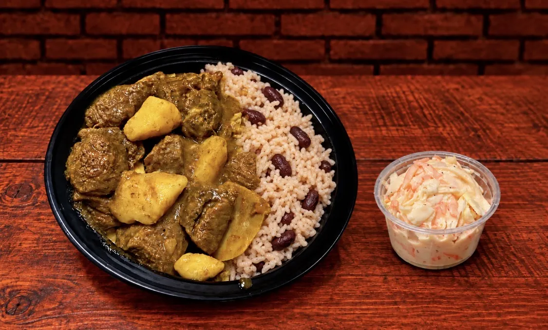 Medium Curry Goat w/Rice n’ Peas
